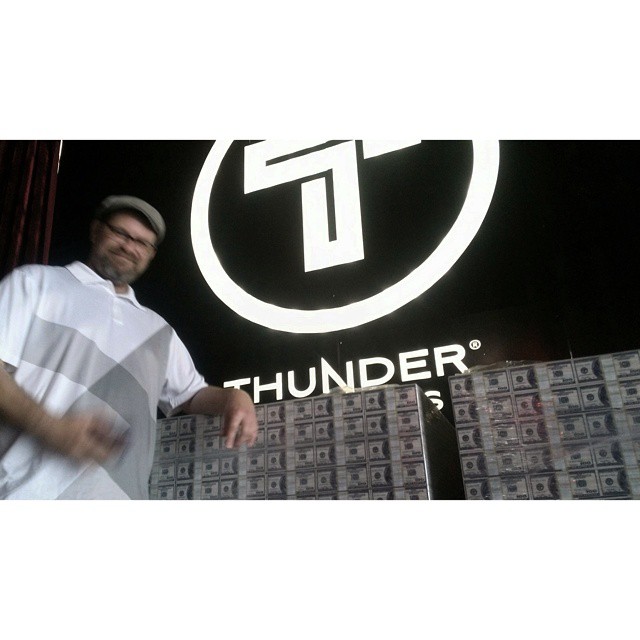 the man is standing in front of thunder radio