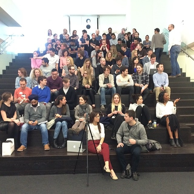 the audience is listening to a speaker at a seminar