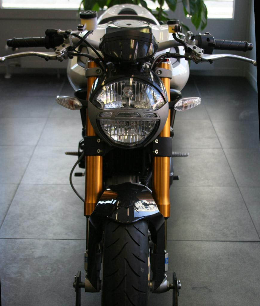 a motorcycle with the headlights on and headlight on