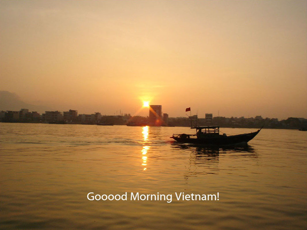 a boat in the middle of a body of water with the sun shining behind it