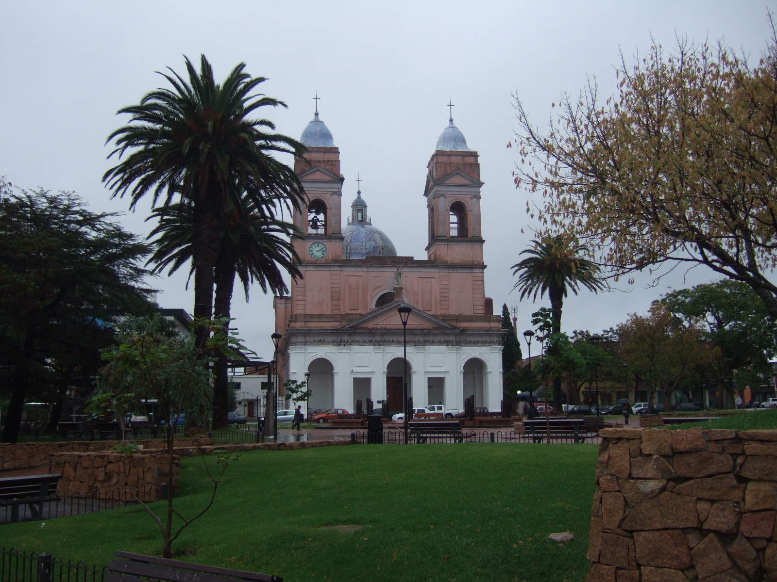 a large white building with three domes