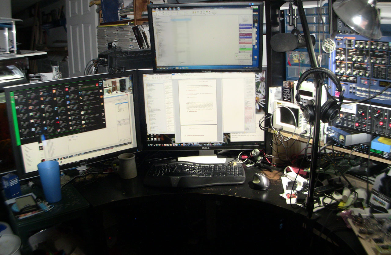 a computer and several computer monitors on a desk