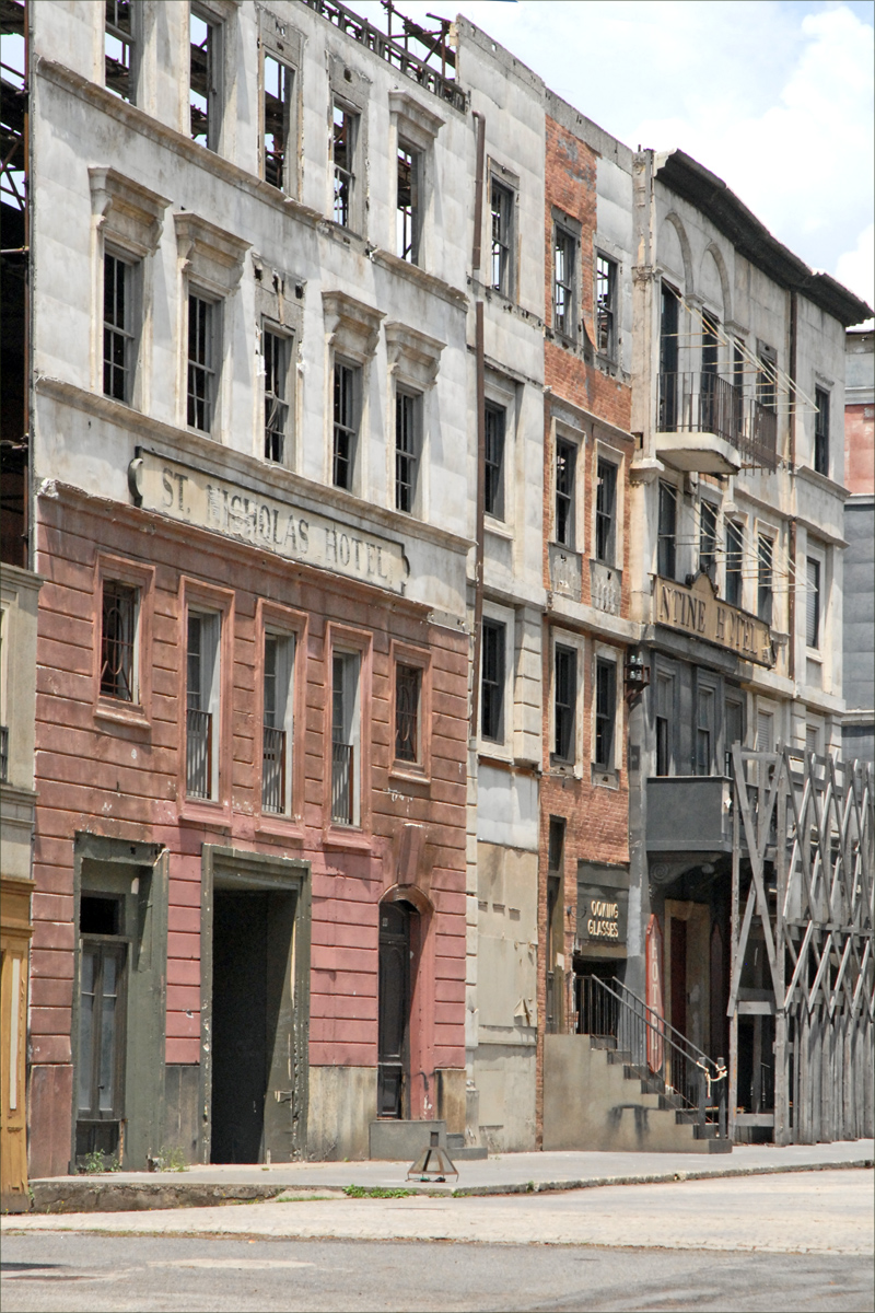 a bunch of older building on the side of a street