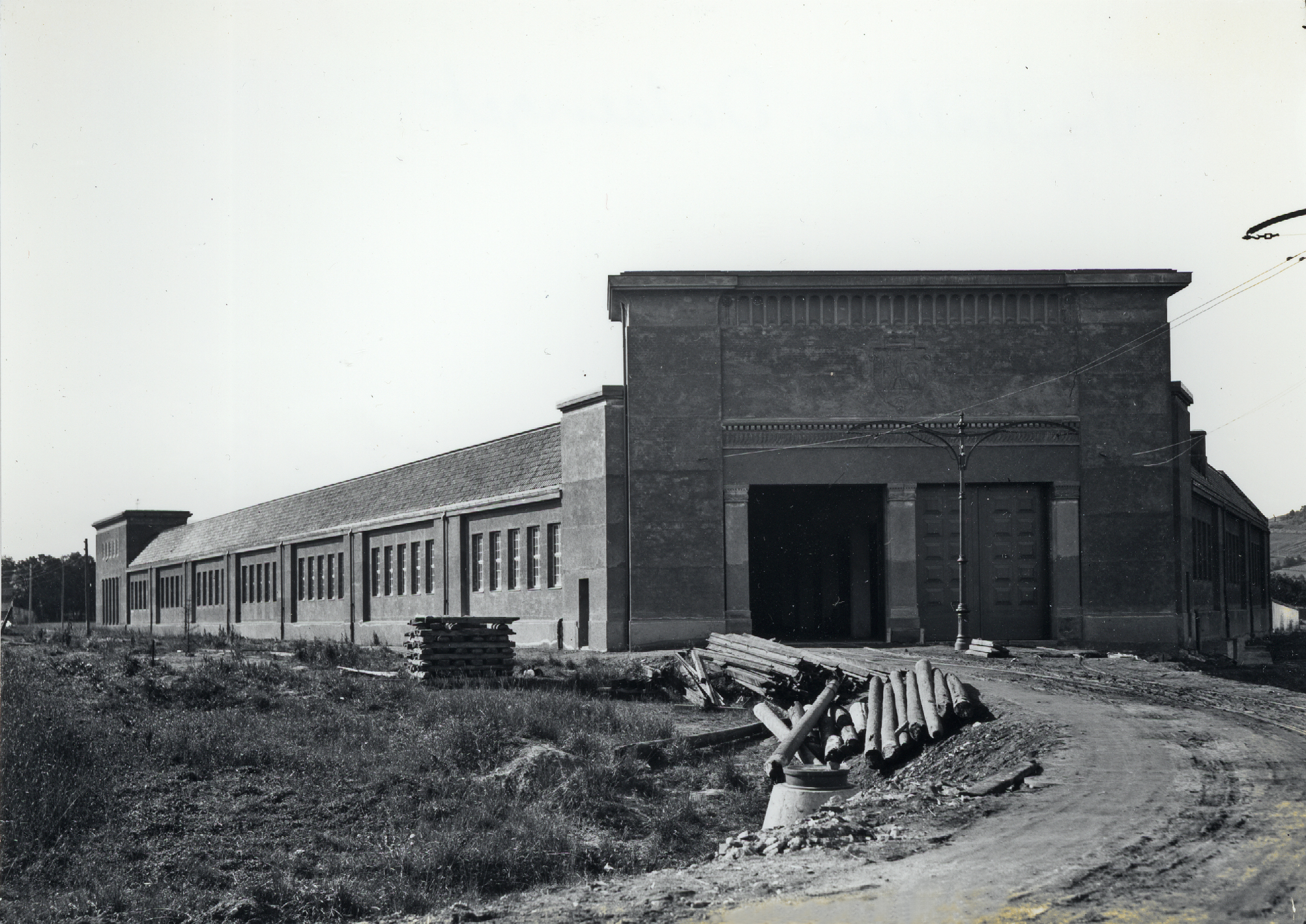 an old po with a building next to a field