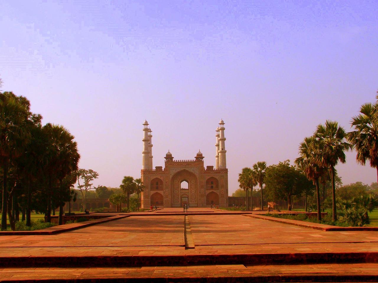 a building has two towers and many trees