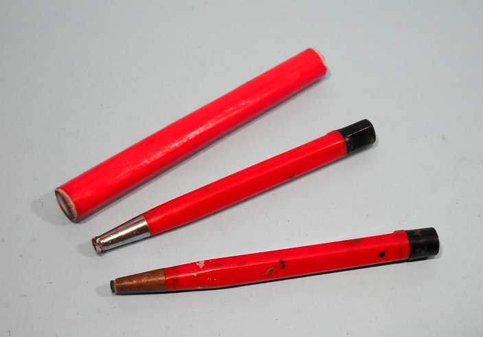 four pens are arranged together with a black nib
