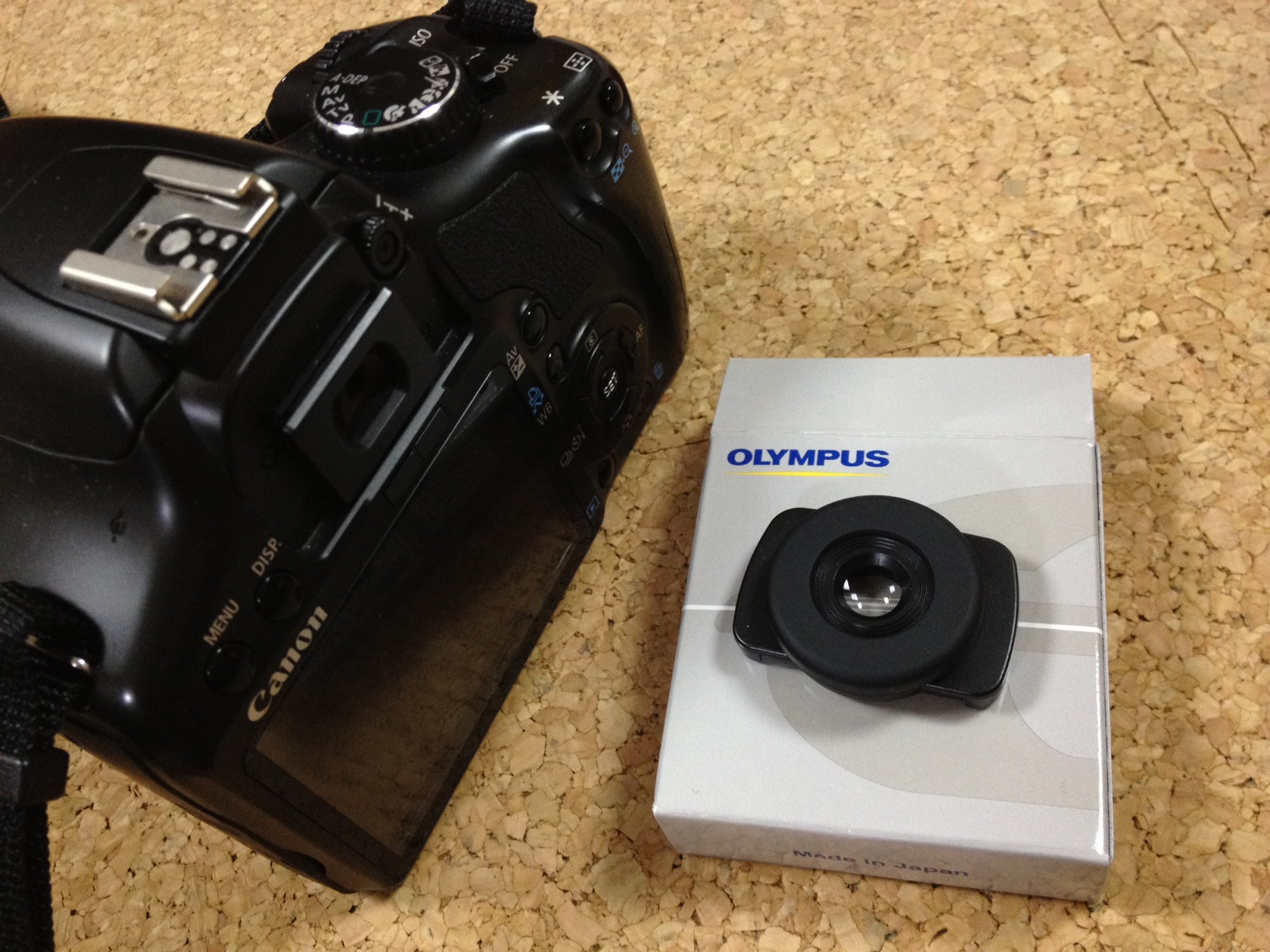 an opened black camera sitting on top of a counter