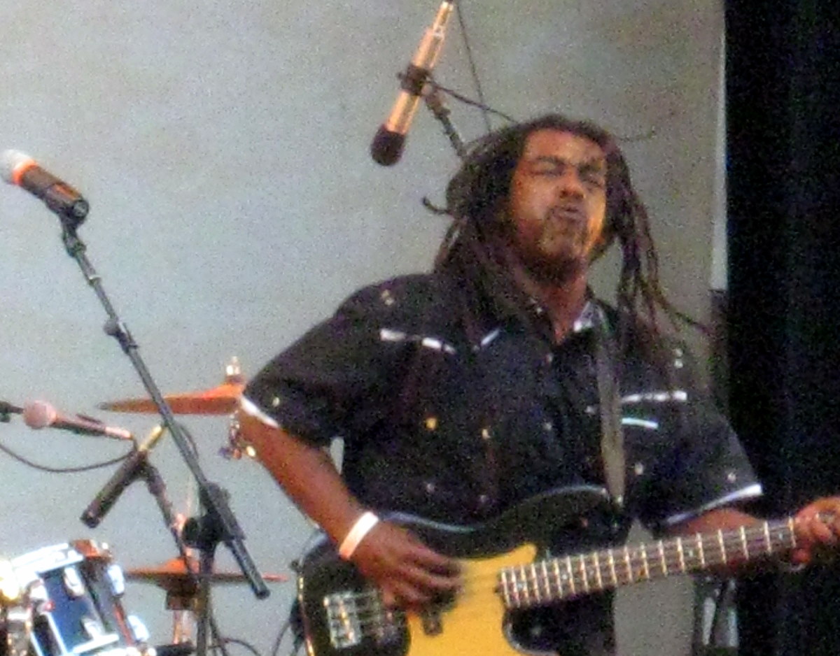 a man plays an electric guitar at an event