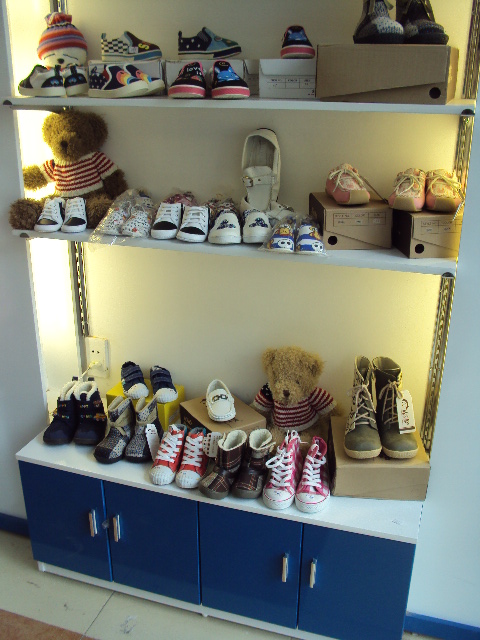 there are shoes that are on display in this room