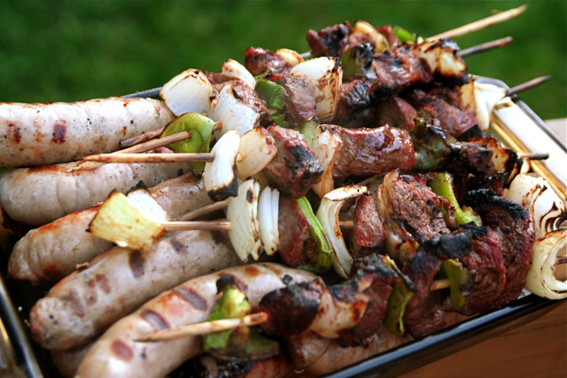 barbecue on skewers with some onions and peppers