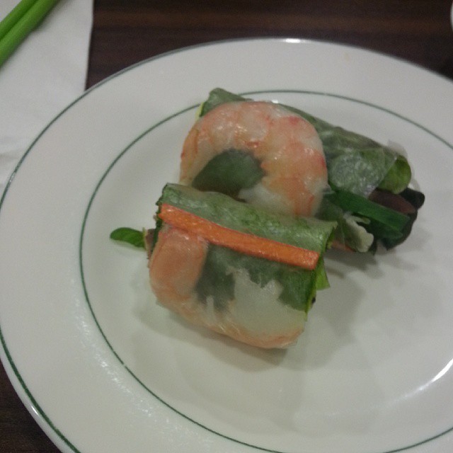 shrimp wrapped with vegetables and sauce on plate