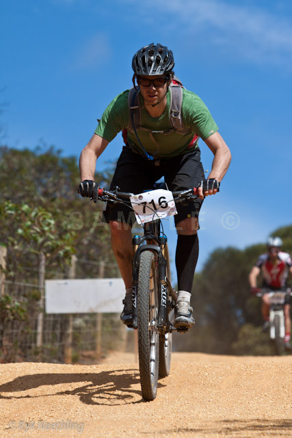 a man riding a bike in the dirt