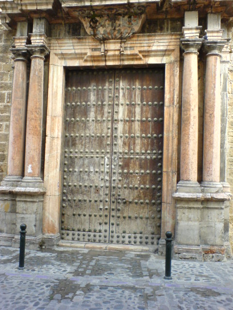 an old building that has a large metal door