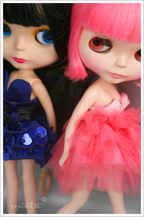 two dolls one with pink hair and the other blue