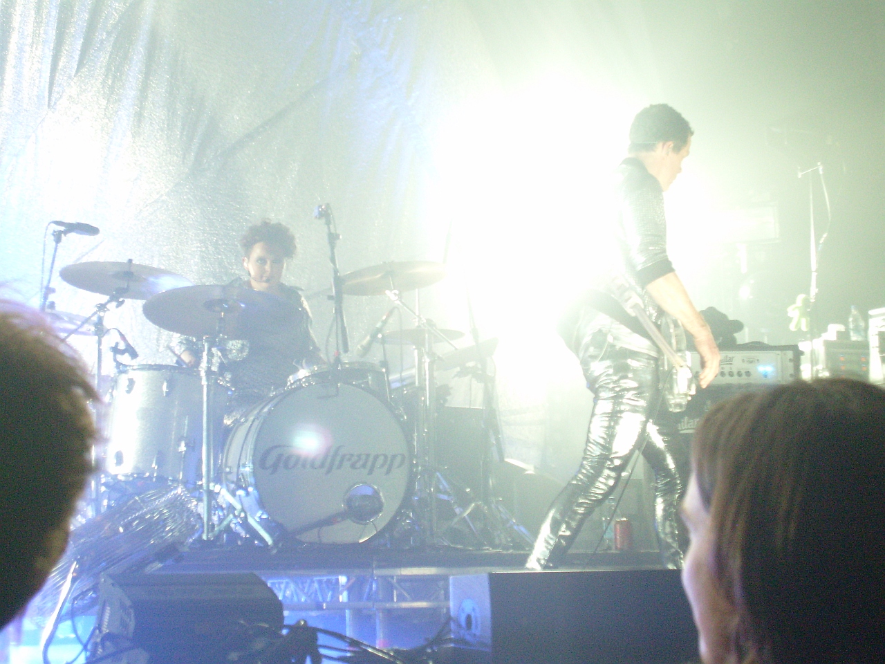 a drummer, drummer and drummer in black and white playing drums
