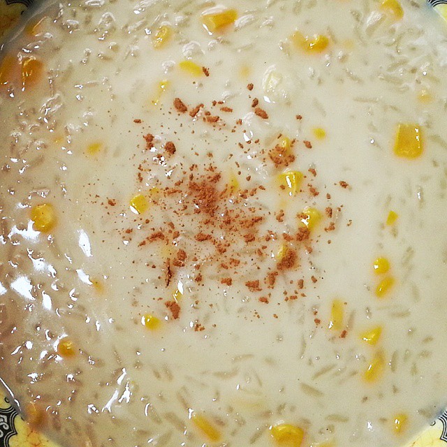 a bowl of soup with corn and a gravy