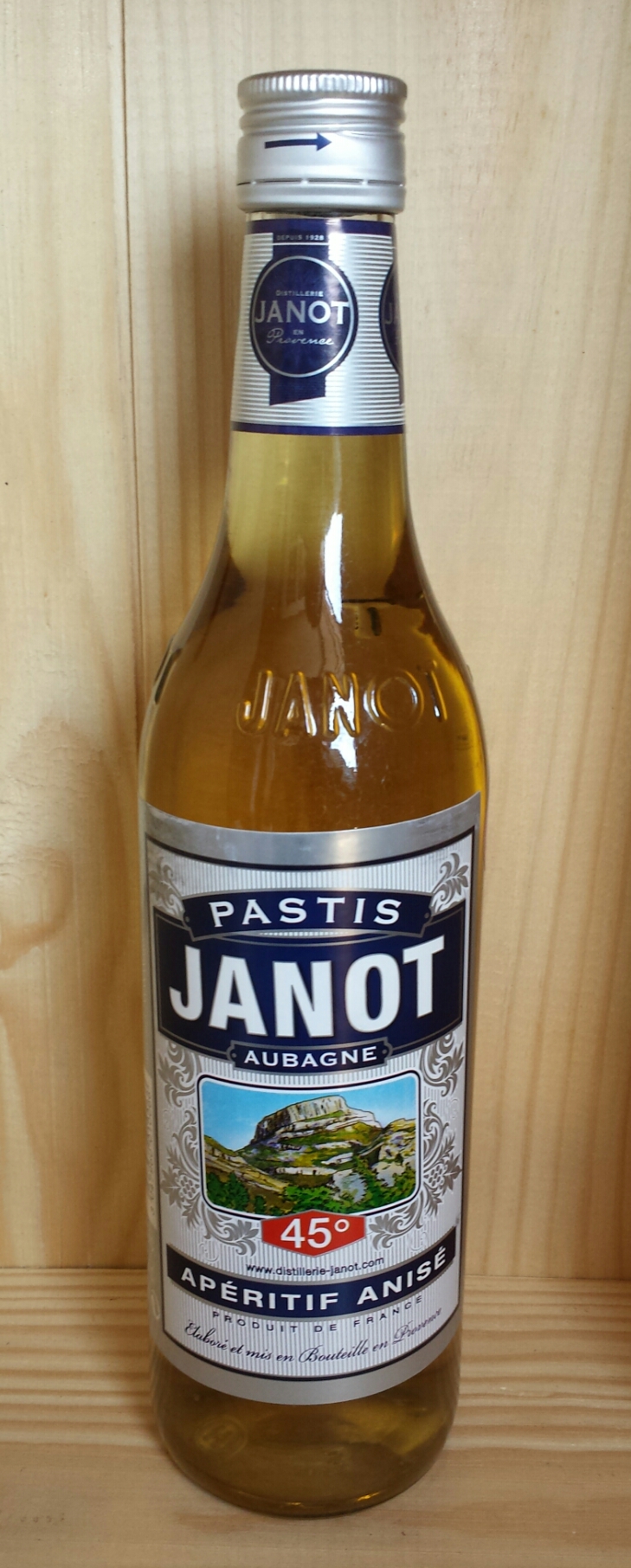 a bottle of jaanijot on a wooden surface