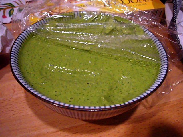 the bowl is filled with green guacamole in a wrapper