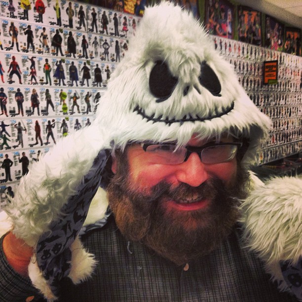 a man wearing a hat made to look like a giant bear