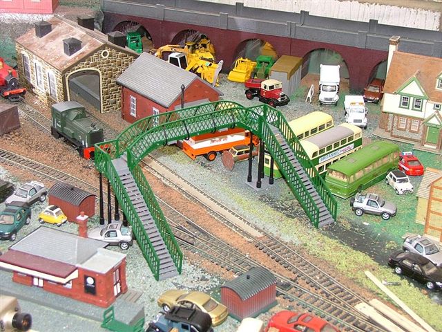 this is a view of the train track, bridge and trains