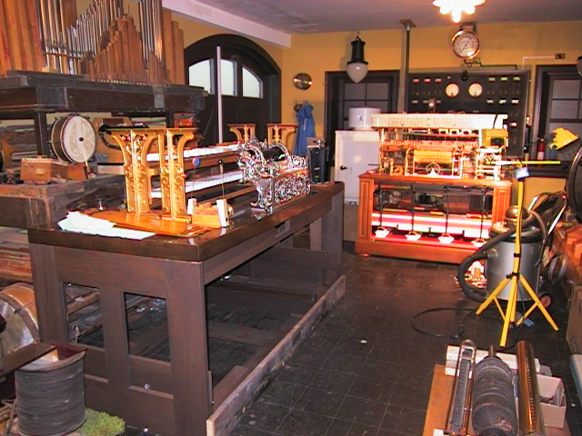 a group of wood and metal objects on display in a room