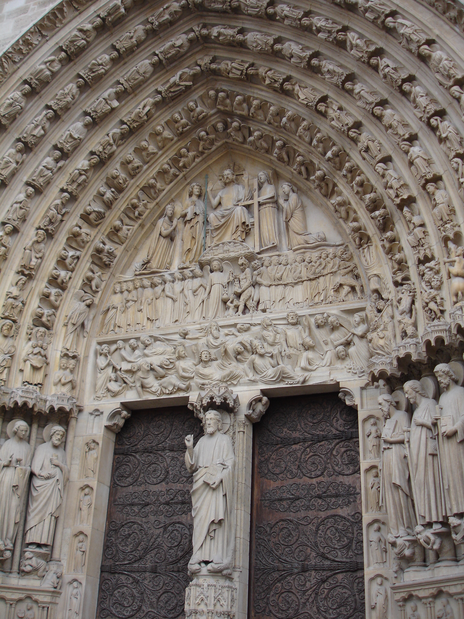 an intricate sculpture of people on a building facade