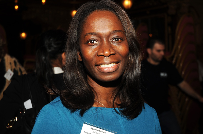 a close up of a person wearing a blue shirt