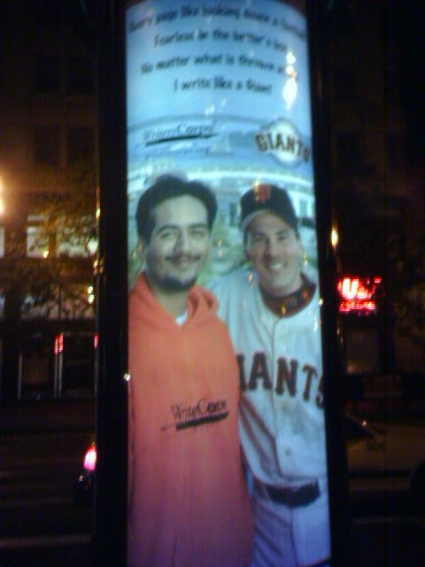 a poster advertising some baseball players on a pole