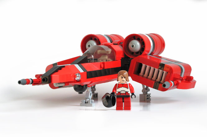 a small toy with a plane and a red car