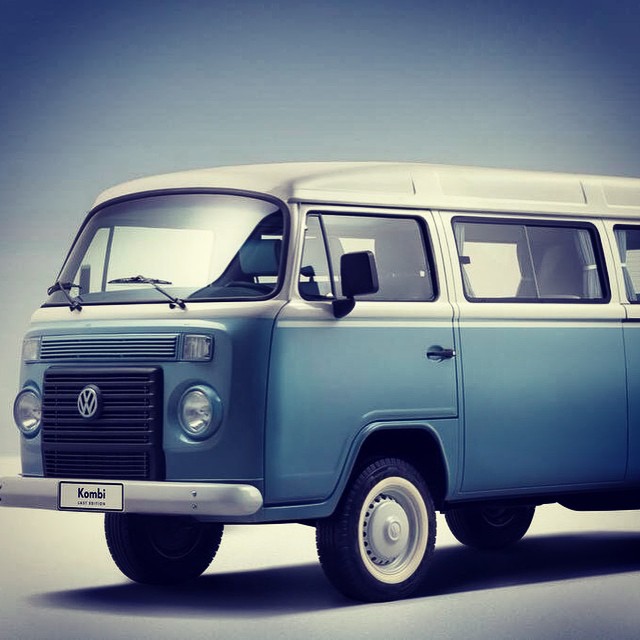 an old blue volkswagen panel van in greyscape