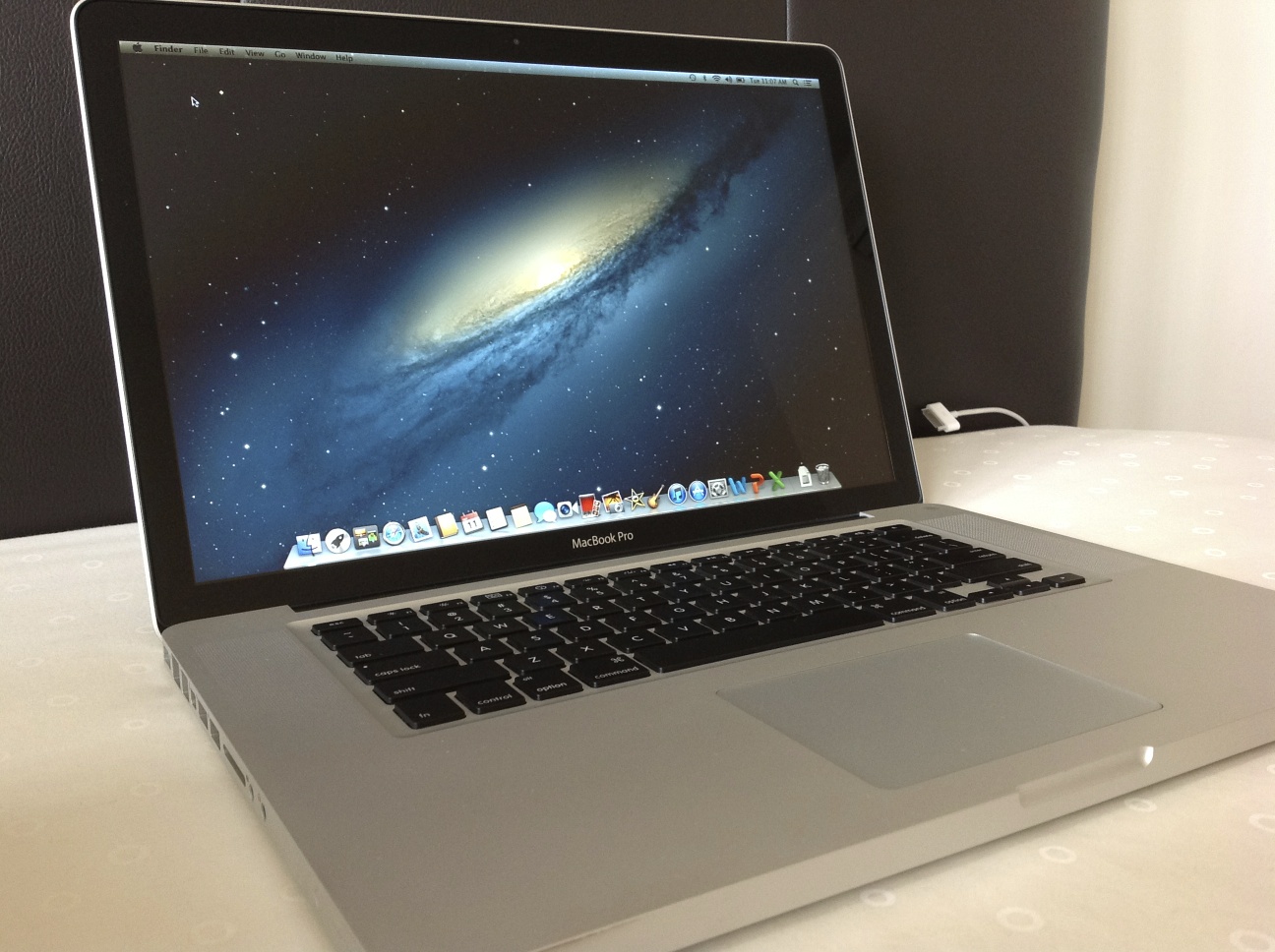 there is an apple macbook pro laptop sitting on a table