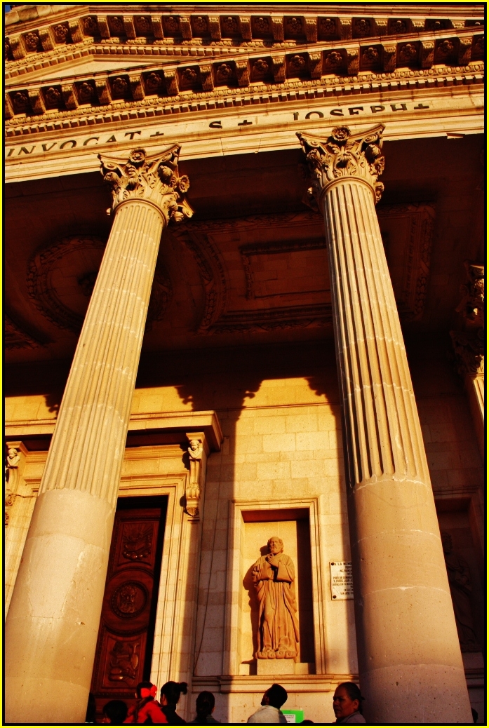 a large old stone building with many columns