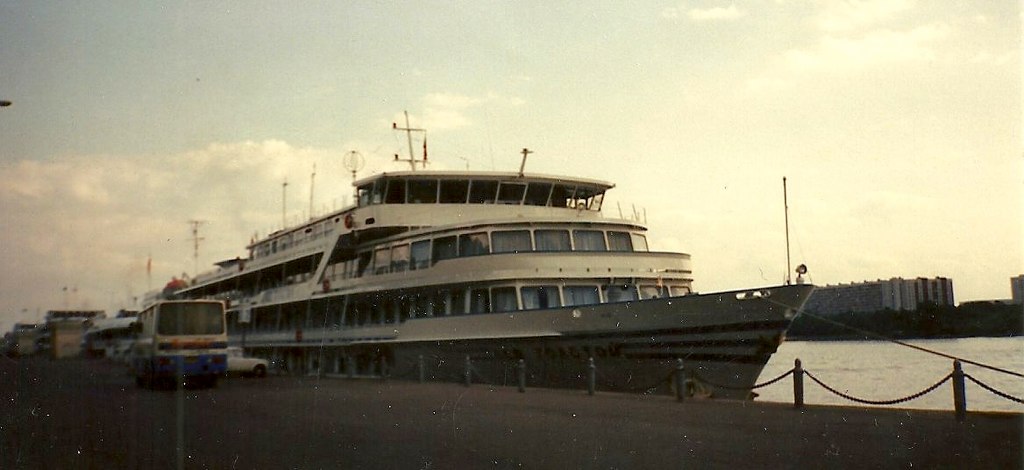 a large ship in a port surrounded by water