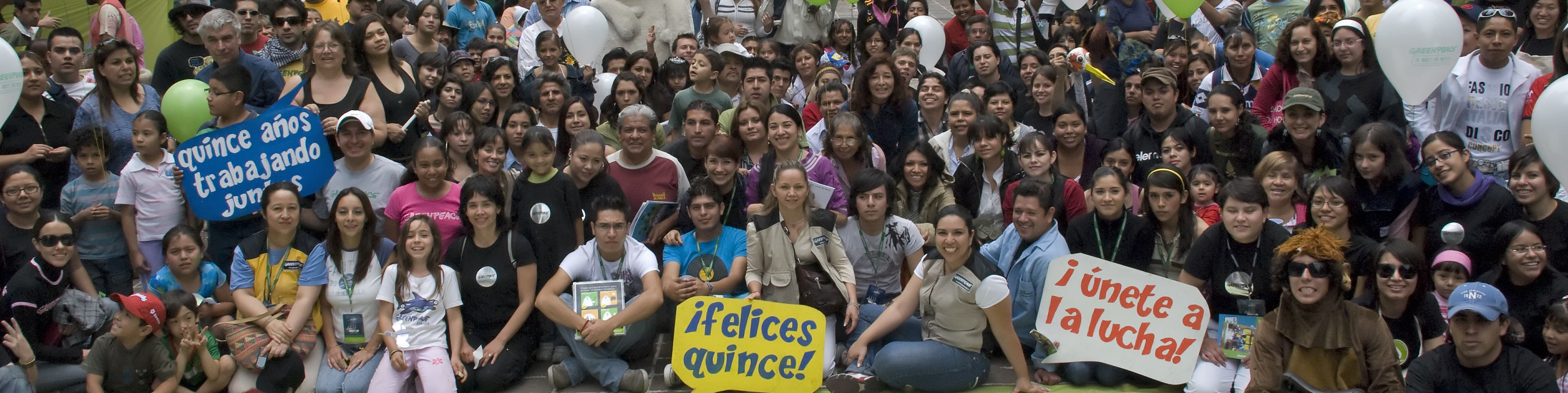 a group of people is shown with many signs