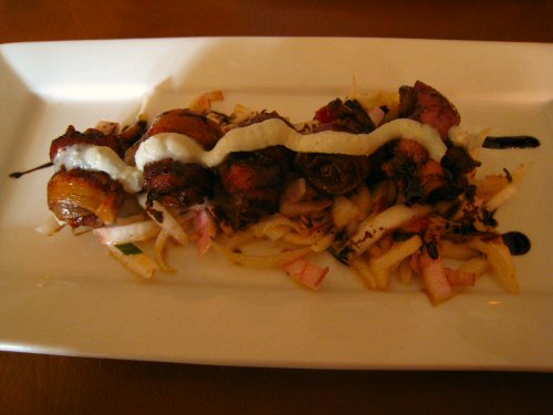 meatballs and french fries on a white plate