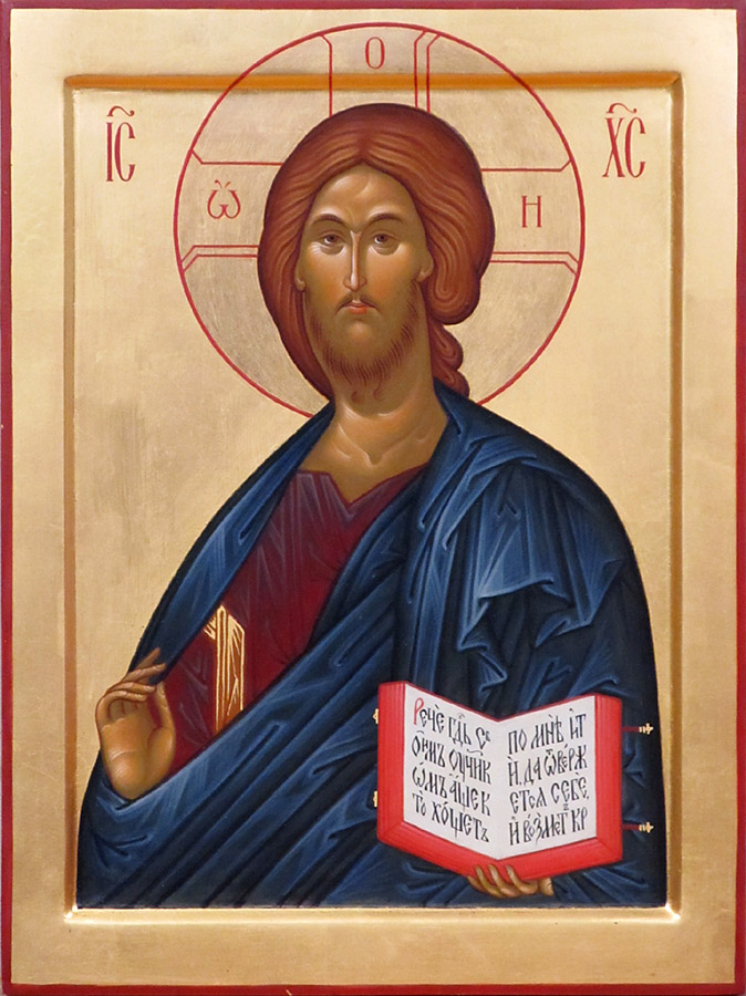 a close up of an icon with a cross