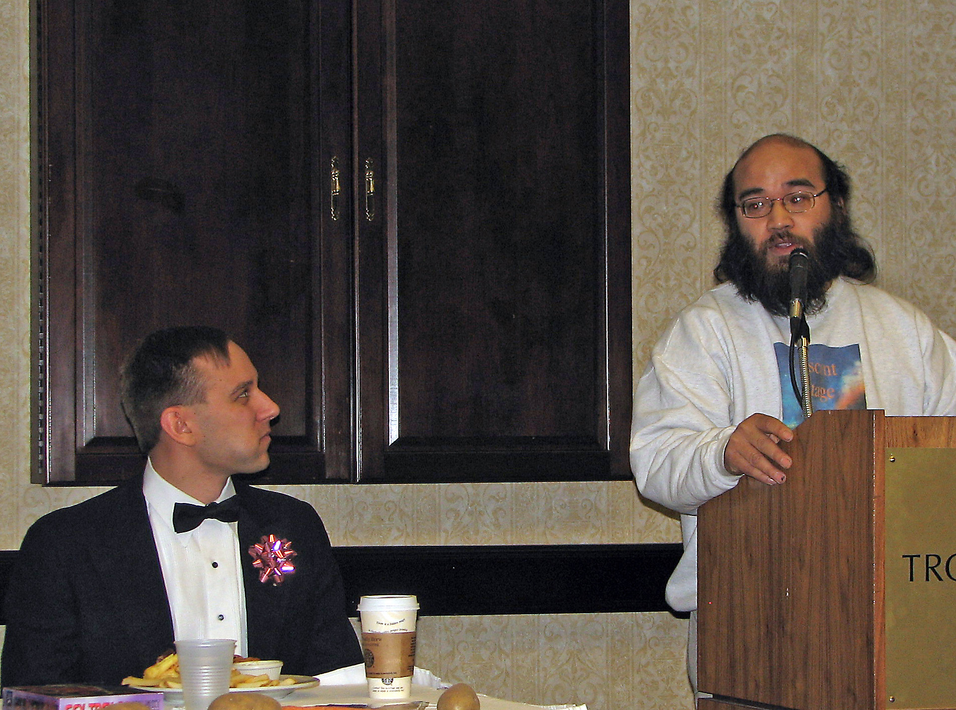 man giving a speech at a formal event