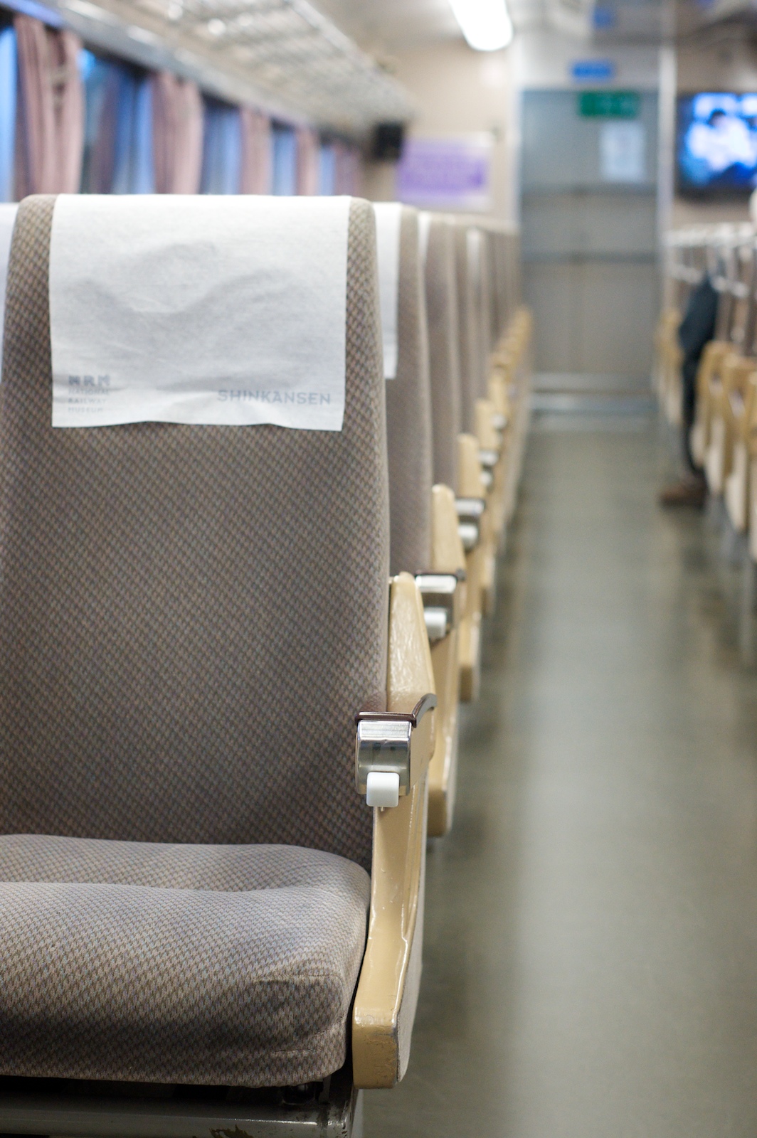 an empty train car has a few chairs