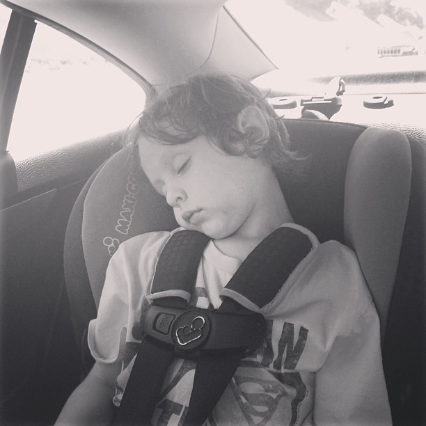 the child is sleeping in the car seat