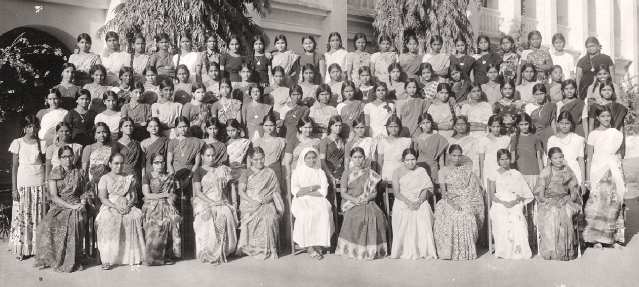 a group of people are posing for a pograph together