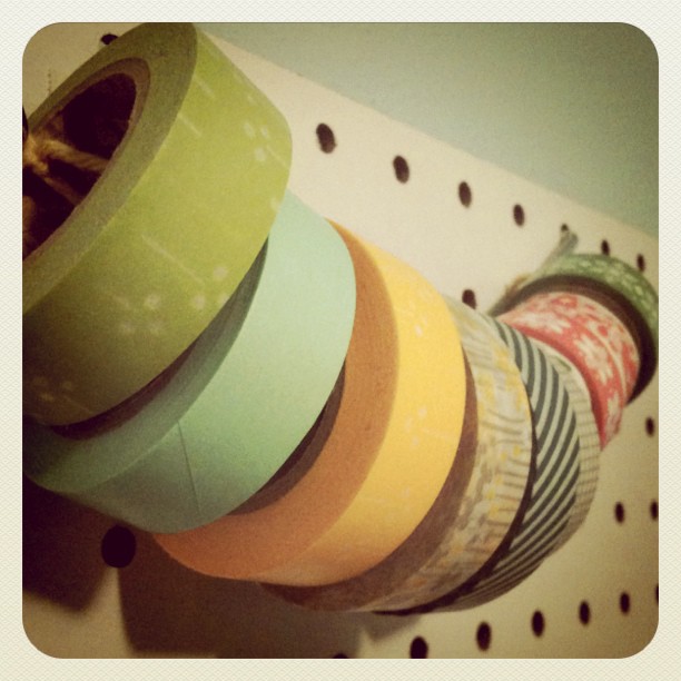 a close up of an assortment of tape spools on a rack