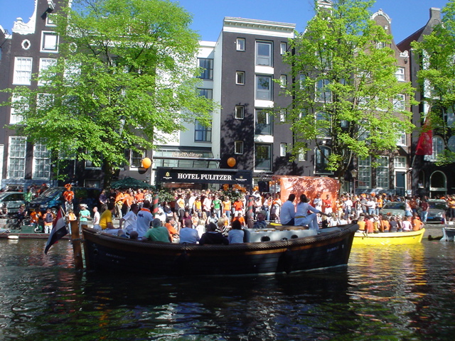 many people are gathered in a boat on the water