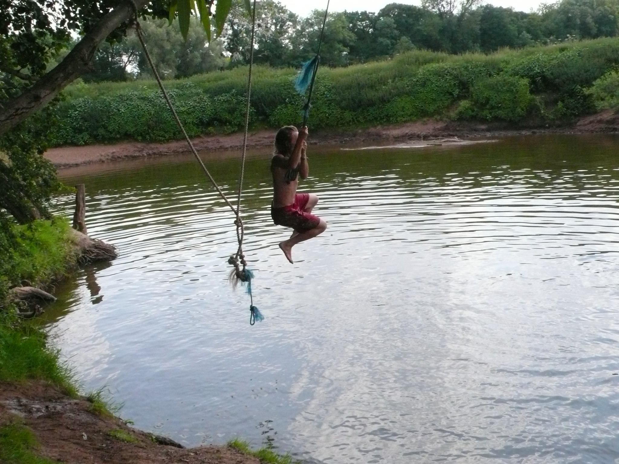 a girl on a high jump in a lake