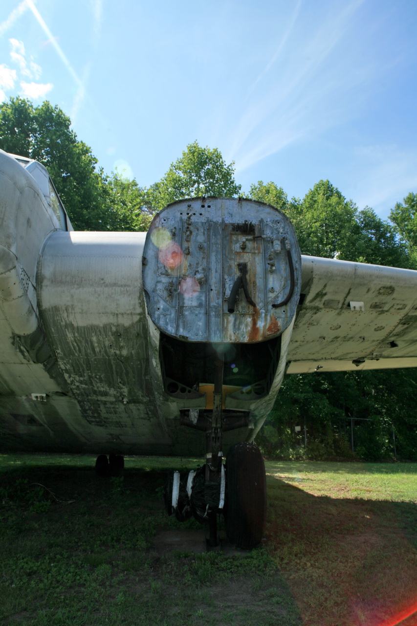 an old world war ii bomber sitting on display