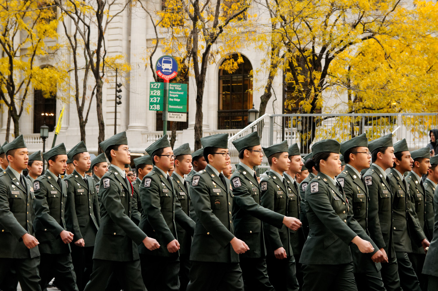 a military parade in the park with the green uniform