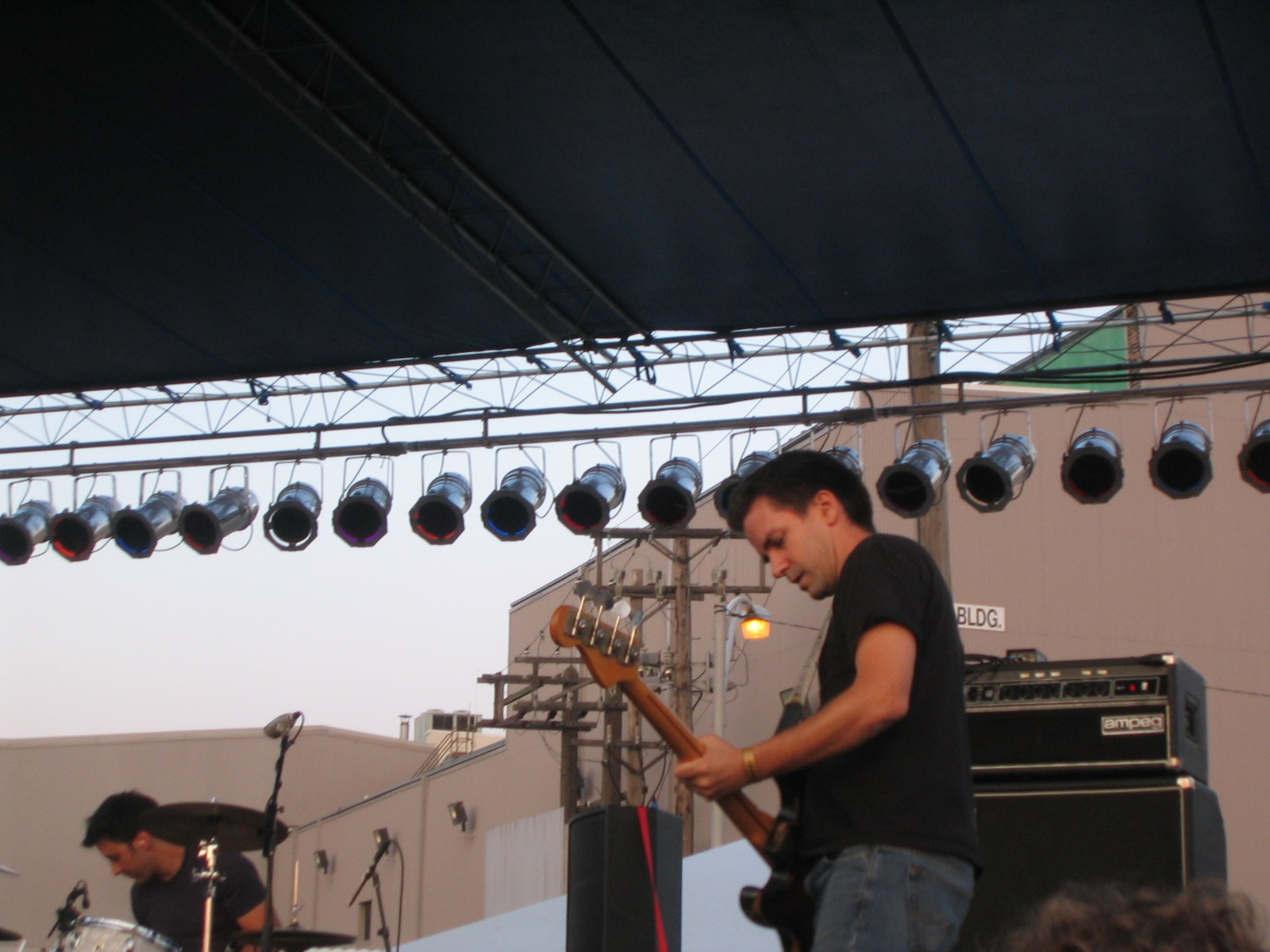 a man is playing an electric guitar on stage