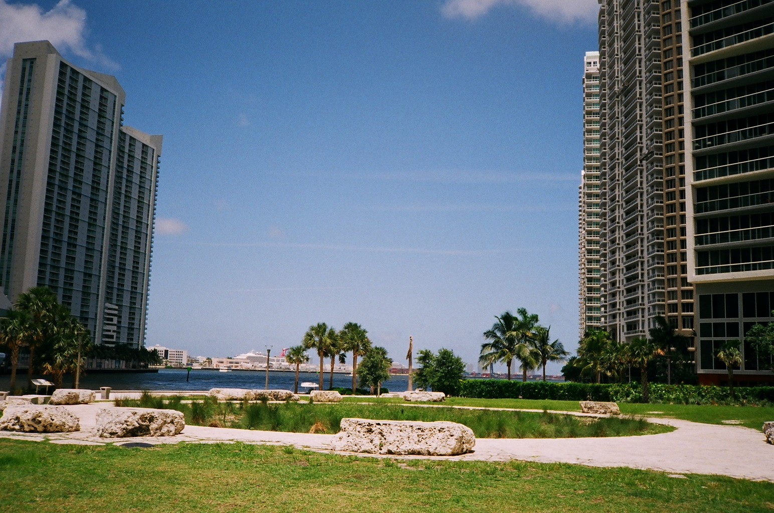 several buildings and small lawns are next to water