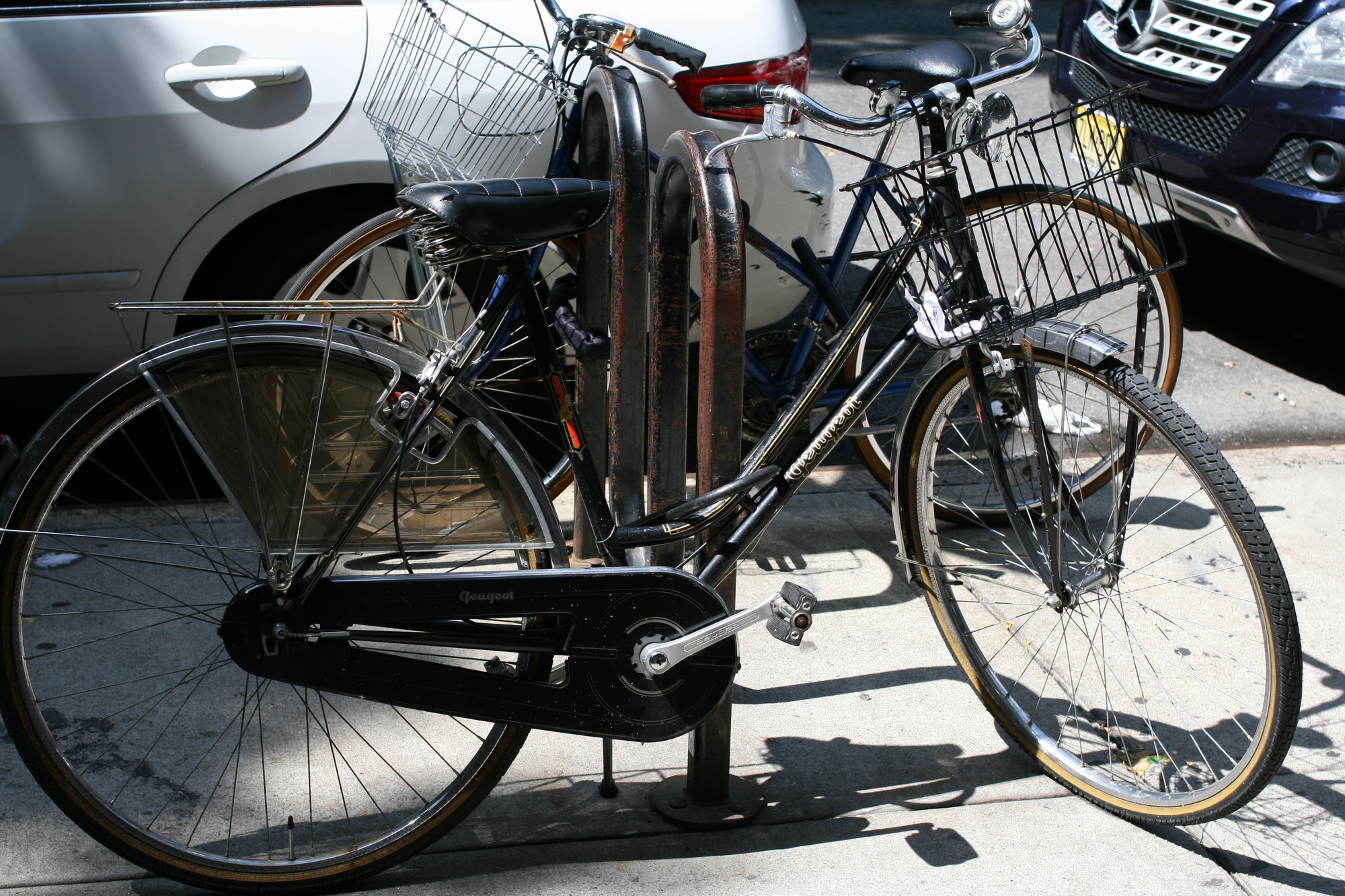 a close up of a bicycle parked near a curb