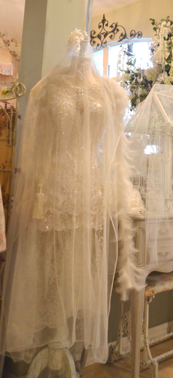 a piece of wedding dress is displayed in a shop