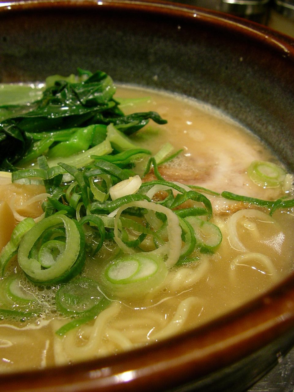 a close up view of some noodles and vegetables